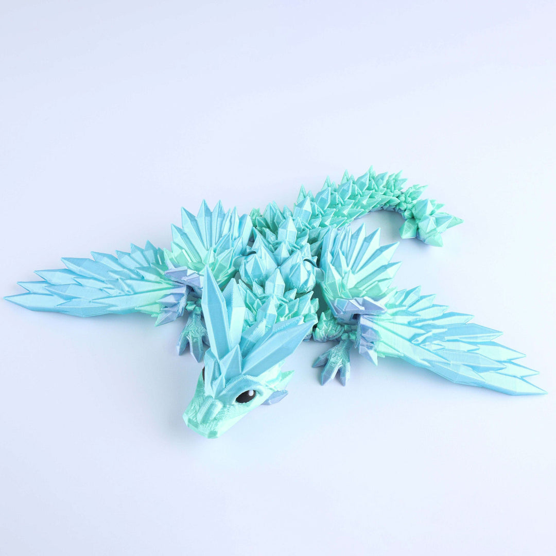 Light blue crystal wing baby dragon fidget toy with articulated spiked body