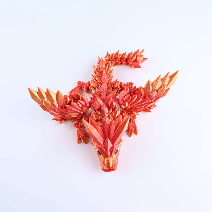 Red crystal wing baby dragon fidget toy with articulated spiked body and forward gaze