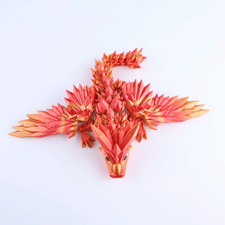Orange crystal-wing baby dragon fidget toy with faceted scales and pointed tail