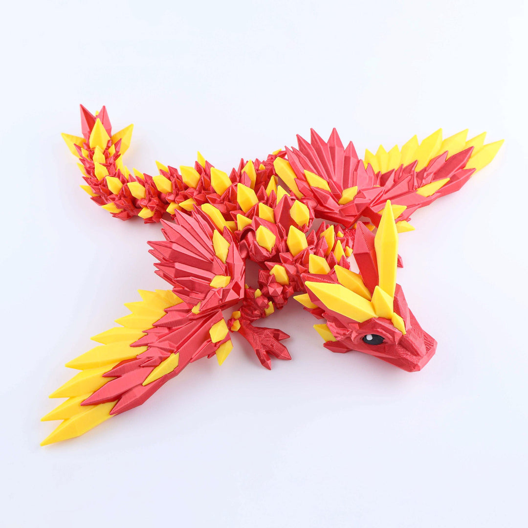 Red and yellow crystal-wing baby dragon fidget toy with faceted wings and eye