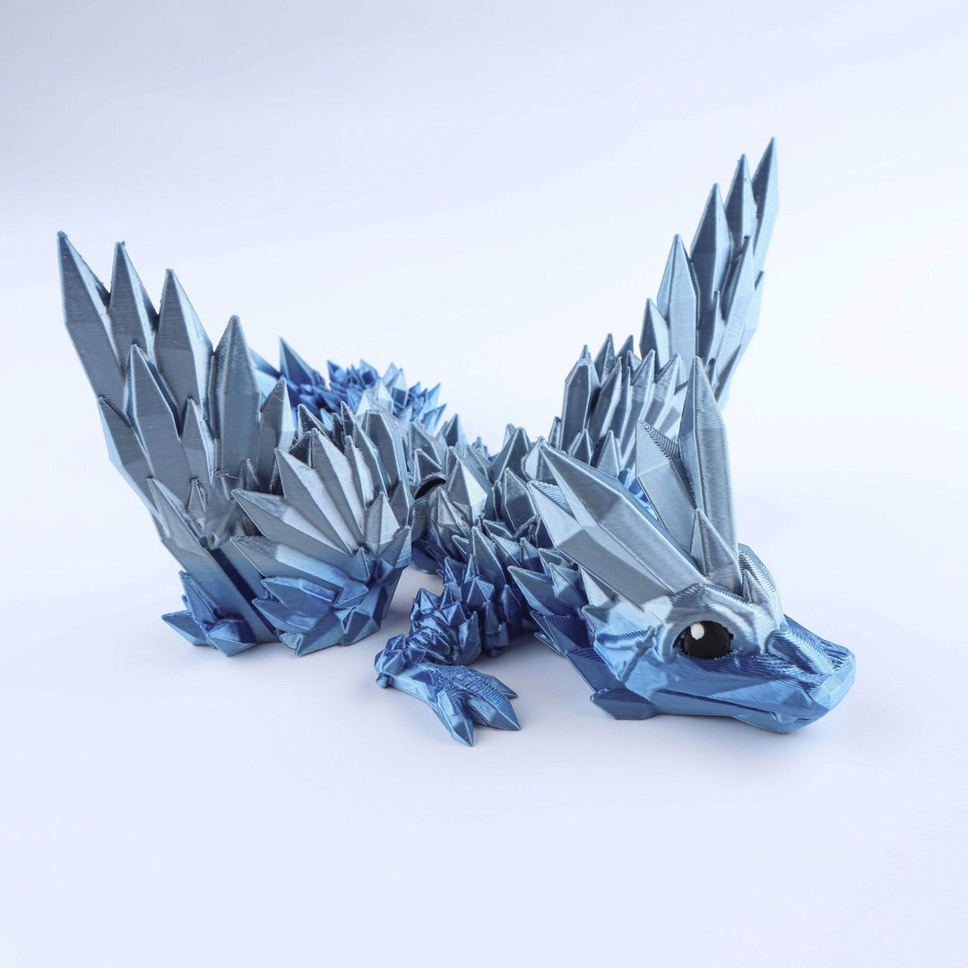 Blue crystal-wing baby dragon fidget toy with faceted scales and jointed wings
