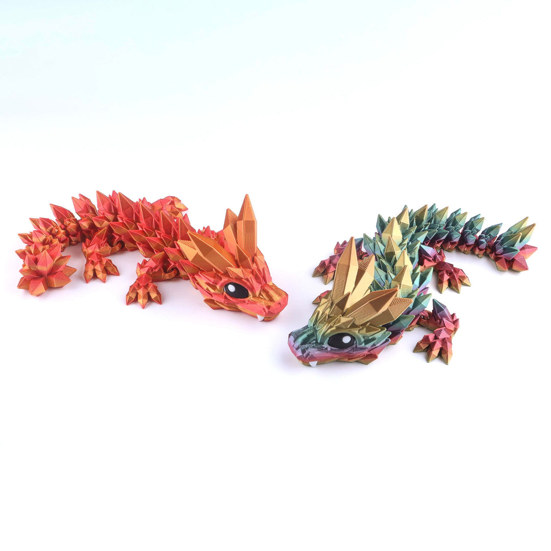 Articulated crystal baby dragon fidget toy, red and gold facets, curled body