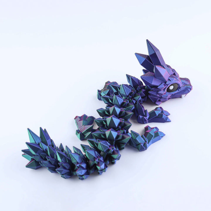 Articulated crystal baby dragon fidget toy, purple-blue crystal scales, open eye