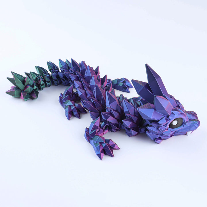 Articulated crystal baby dragon fidget toy in blue and purple faceted scales