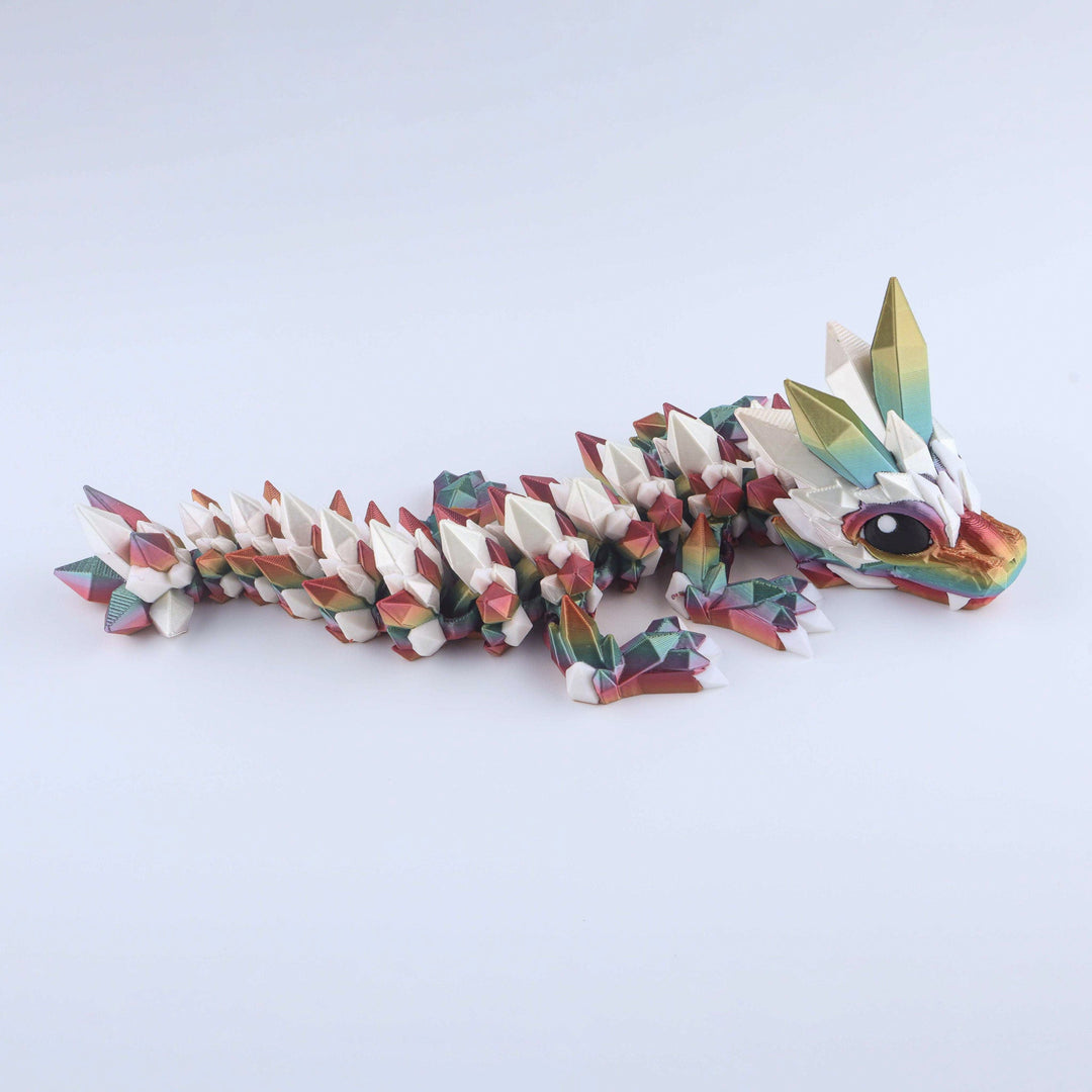 Articulated crystal baby dragon fidget toy, white base with rainbow iridescent facets