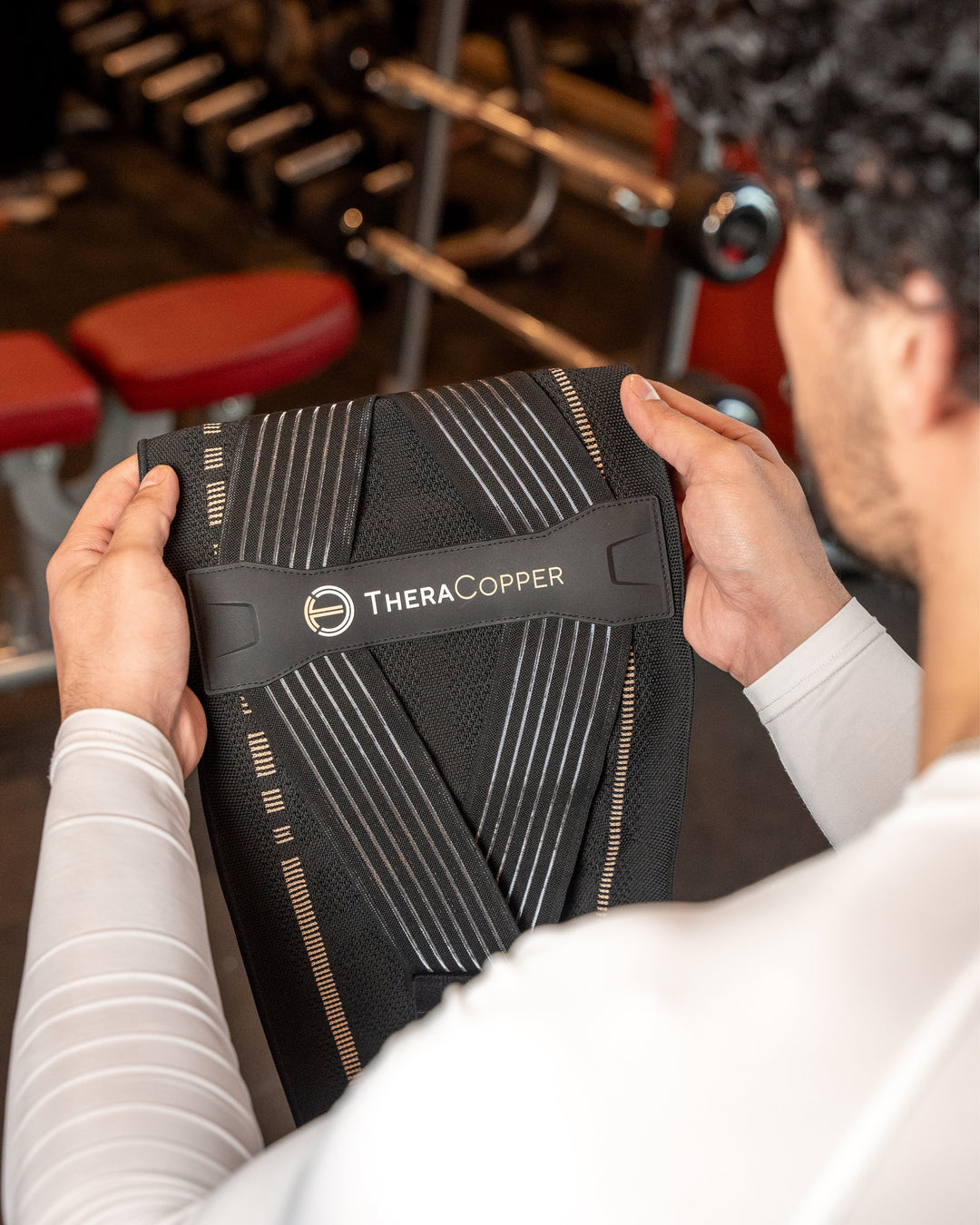 TheraCopper lower back compression brace, black fabric with logo and support straps