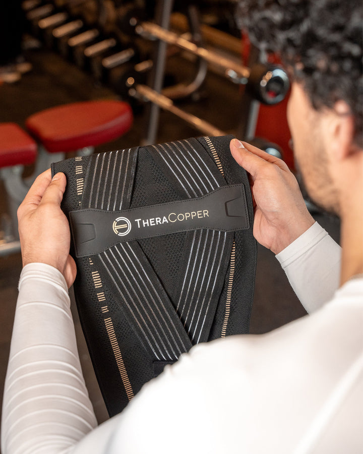 TheraCopper lower back compression brace, black fabric with logo and support straps