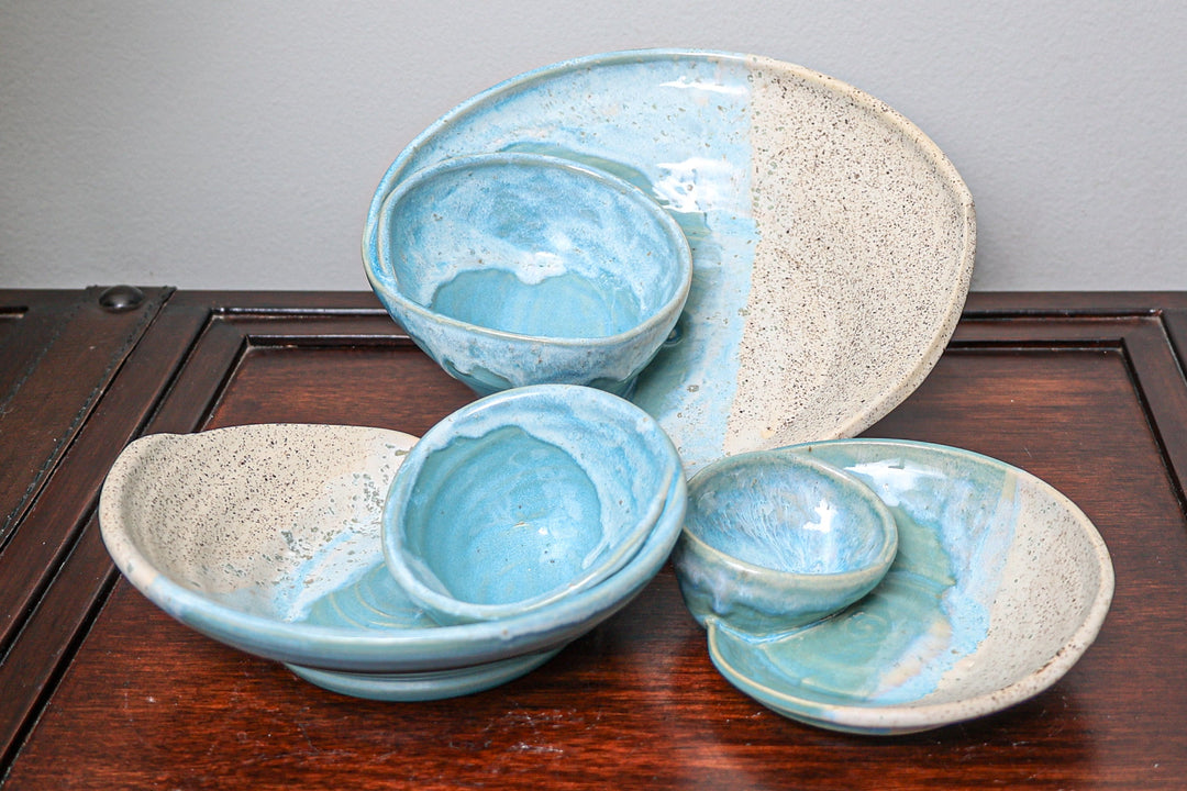 Coastal ceramic bowl set in blue and beige speckled swirl glaze, with small dish