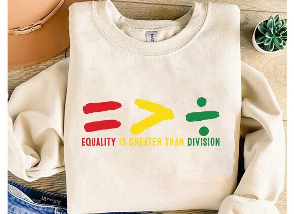 Off-white unisex crew-neck sweatshirt-style T-shirt with multicolor equality graphic.