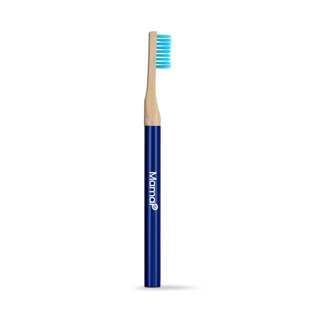 Manual toothbrush with dark blue handle and light wood grip, bristles up