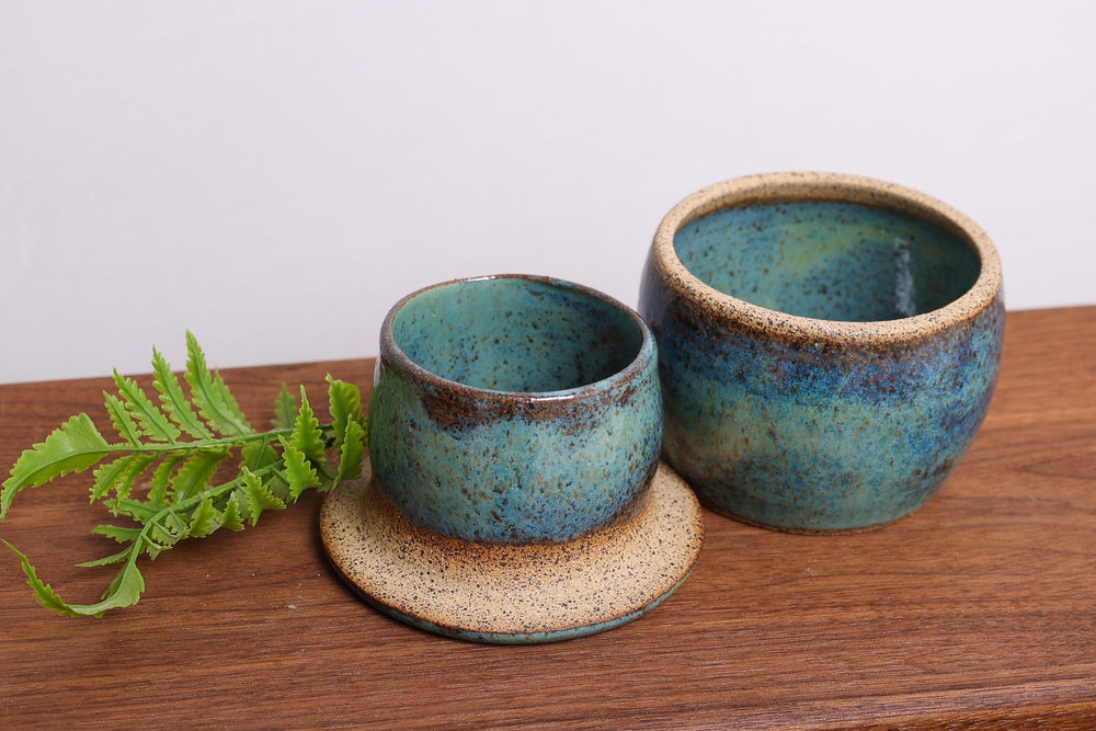 Ceramic butter dish set with two teal bowls and plate, speckled glaze