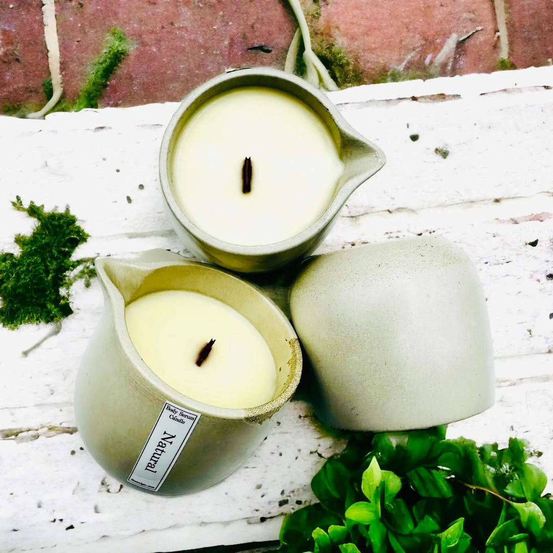 Body oil serum candle trio in light green containers with white wax and wicks