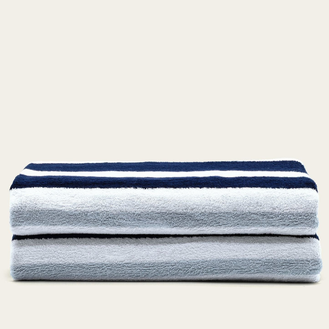 Cotton beach towel set with gray body and navy striped border