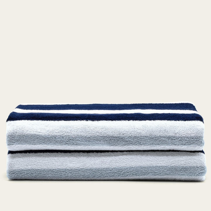 Cotton beach towel set with gray body and navy striped border
