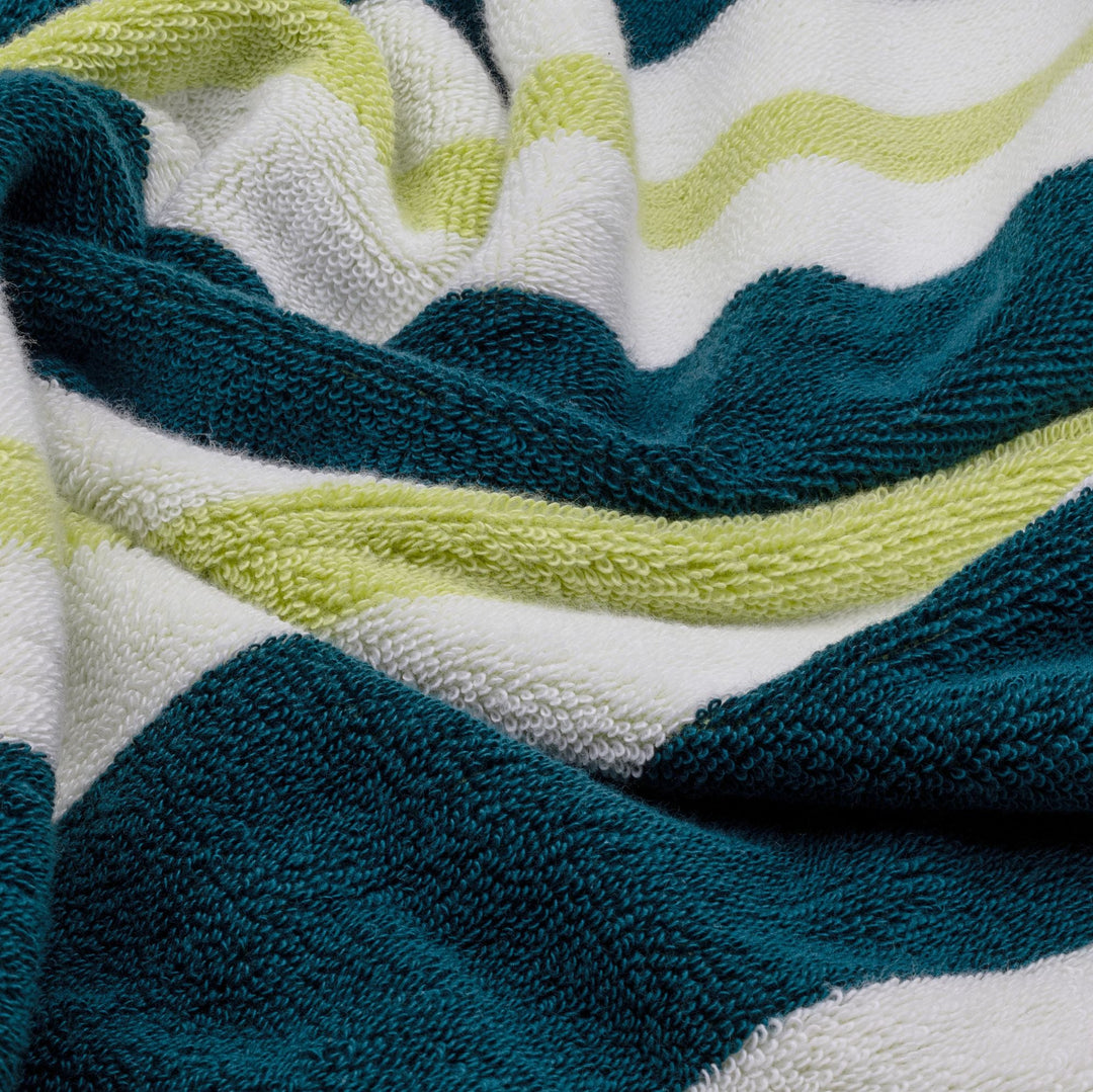 Cotton beach towel with textured terry loops in navy, teal, and lime stripes