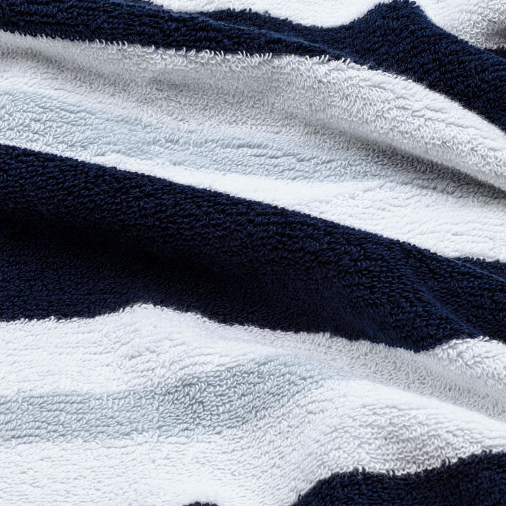 Navy and white striped cotton beach towel with soft terry texture