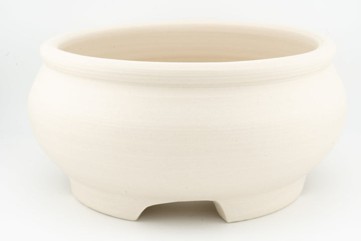 Unglazed white stoneware bonsai pot with three-foot base and round rim
