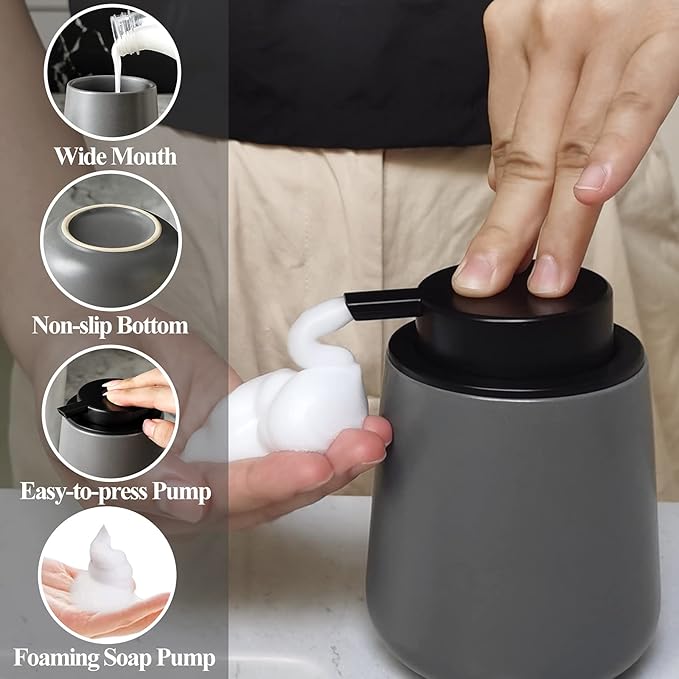 Large ceramic foaming soap dispenser with black pump, dispensing white foam