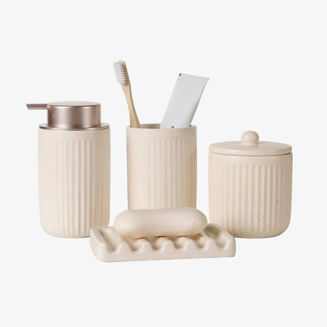 Striped ceramic bathroom accessory set, off-white with copper pump and soap dish