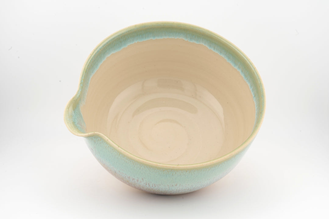 Ceramic bowl with optional spout, turquoise rim and pale interior