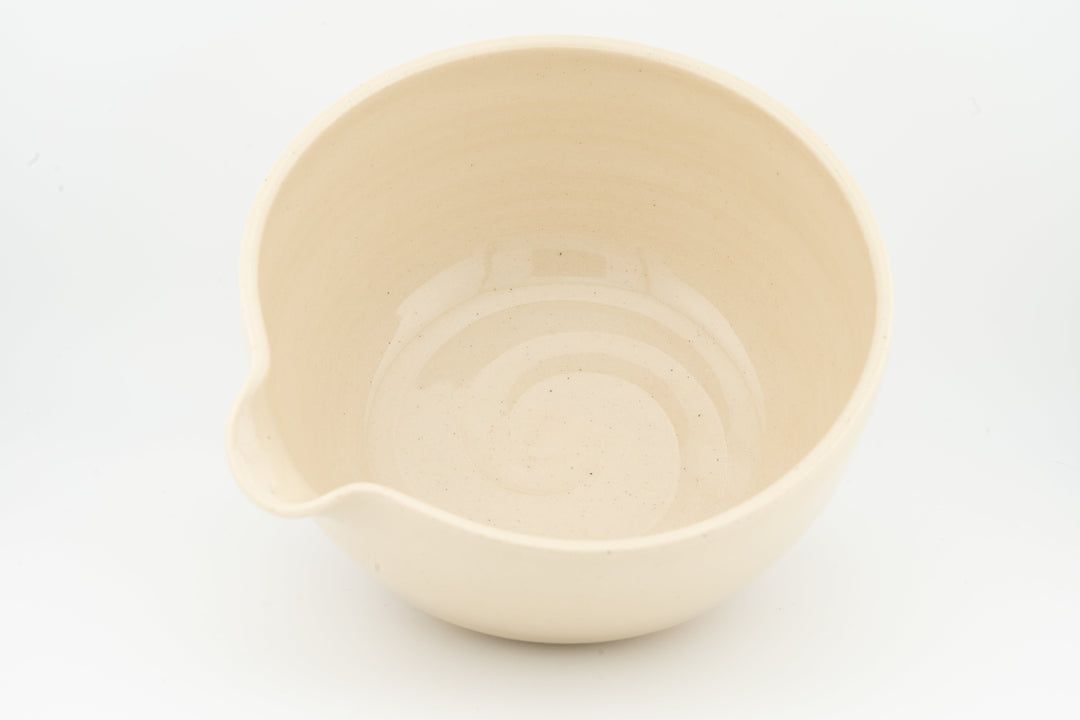 Ceramic bowl with optional spout, cream glaze, with side spout detail