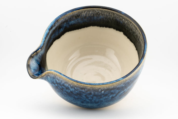Blue ceramic bowl with side spout, glossy interior glaze
