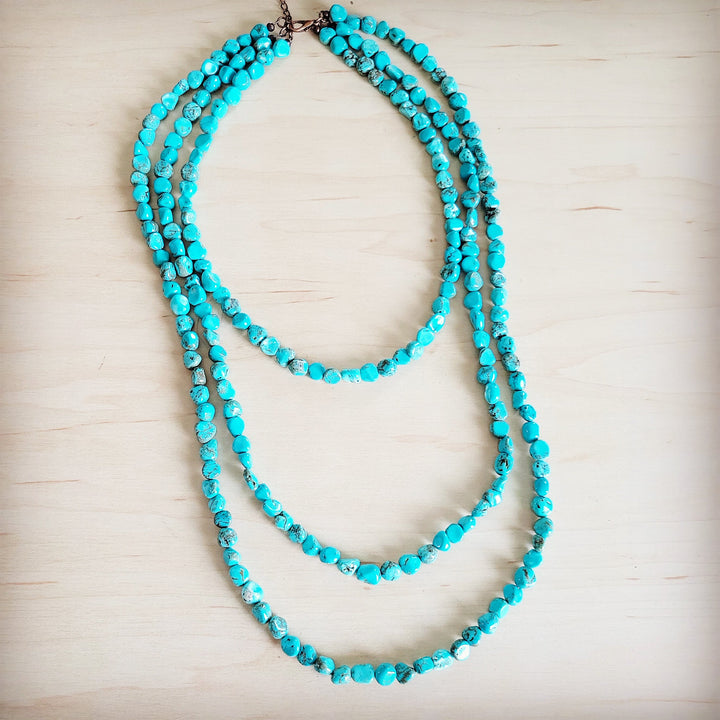 Turquoise multi-strand beaded necklace with round bead strands and clasp