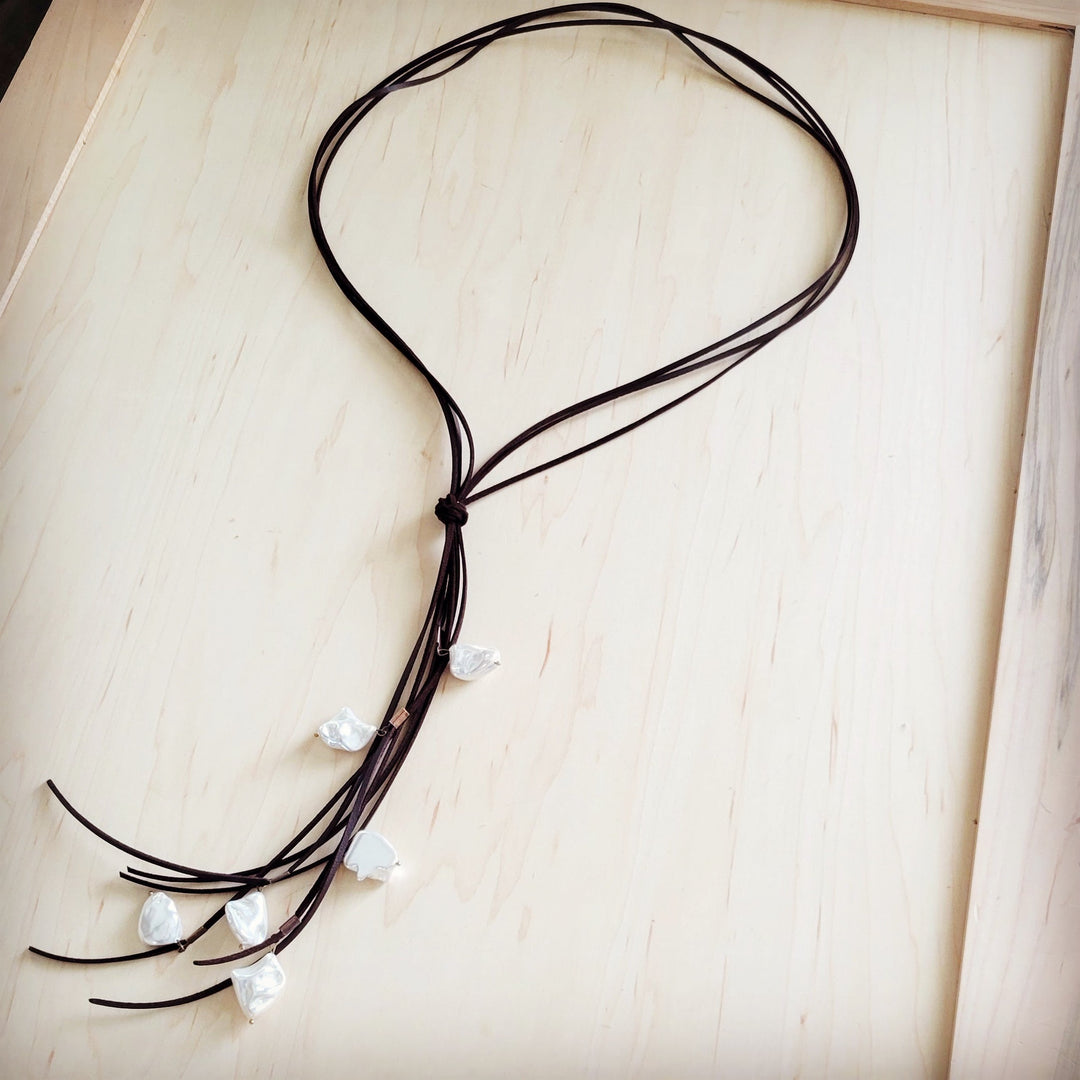 Dark brown knotted leather cord necklace with white pearl drops and layered strands
