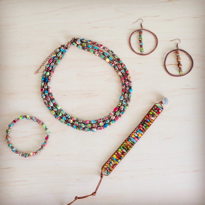 Multi-color beaded stretch bracelet with matching hoop earrings and long beaded accessory