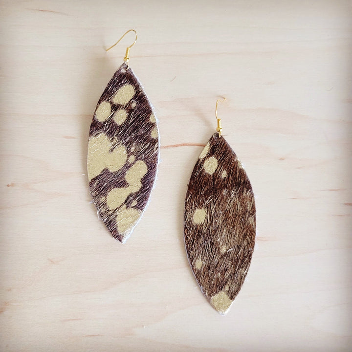 Hair-on-hide oval drop earrings with gold hooks, black-and-white and brown patterns