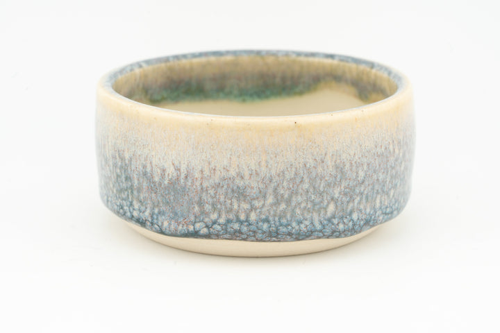 Ceramic condiment cup with textured blue-green glaze and cream inner bowl