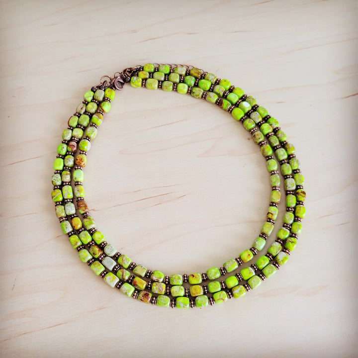Layered beaded necklace with lime green and dark brown square beads, copper clasp