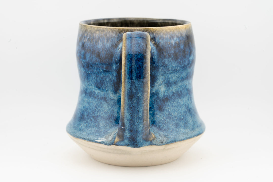 Blue speckled tall ceramic mug with vertical glazed detail at the front