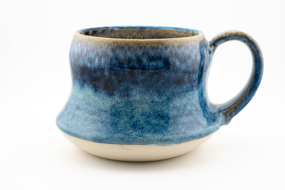 Curvy wide mug, deep blue speckled ceramic glaze with loop handle