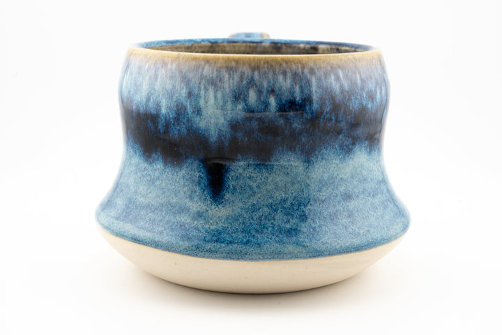 Curvy wide mug, blue speckled ceramic glaze with wide rounded base