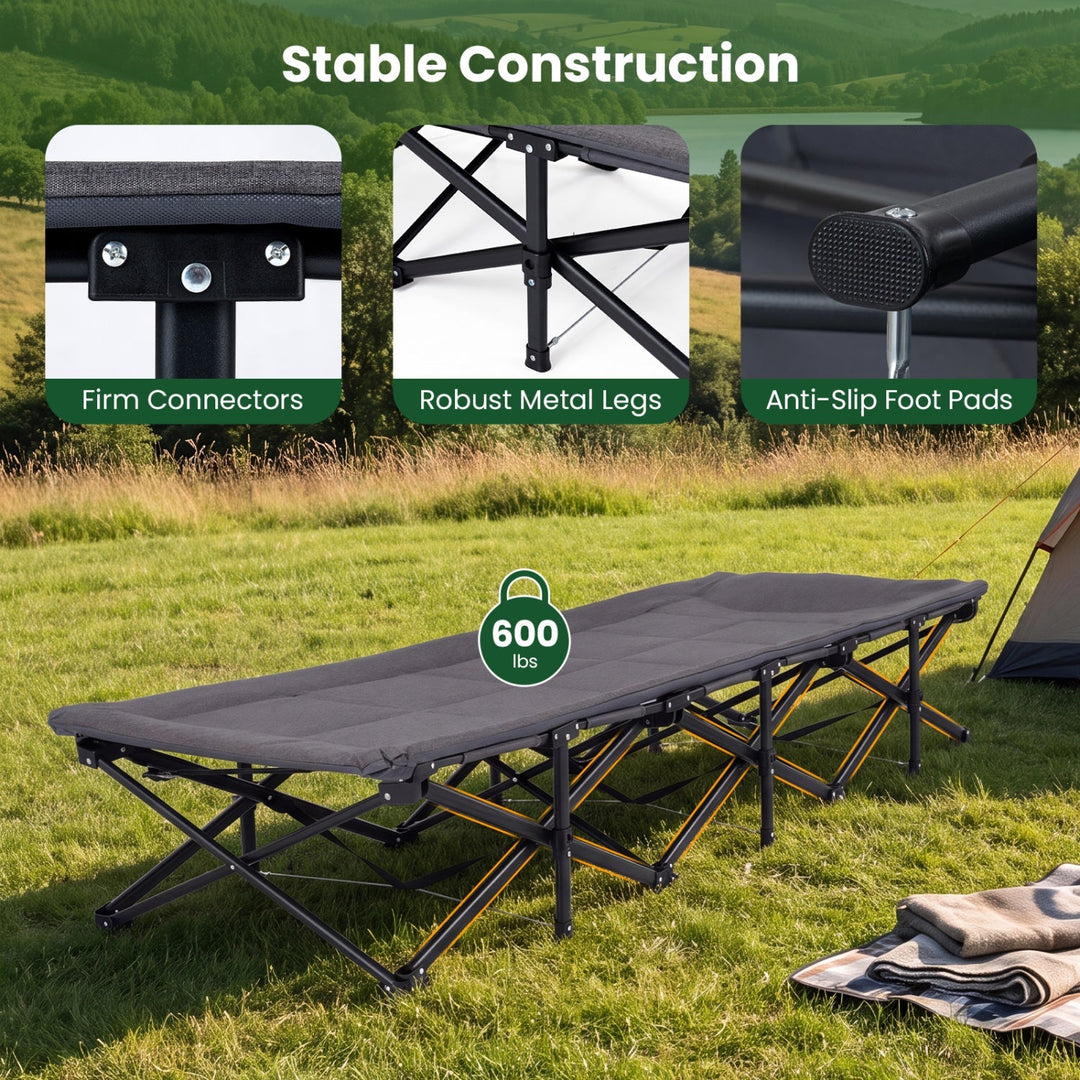 Gray folding camping cot with padded mattress and sturdy black metal legs
