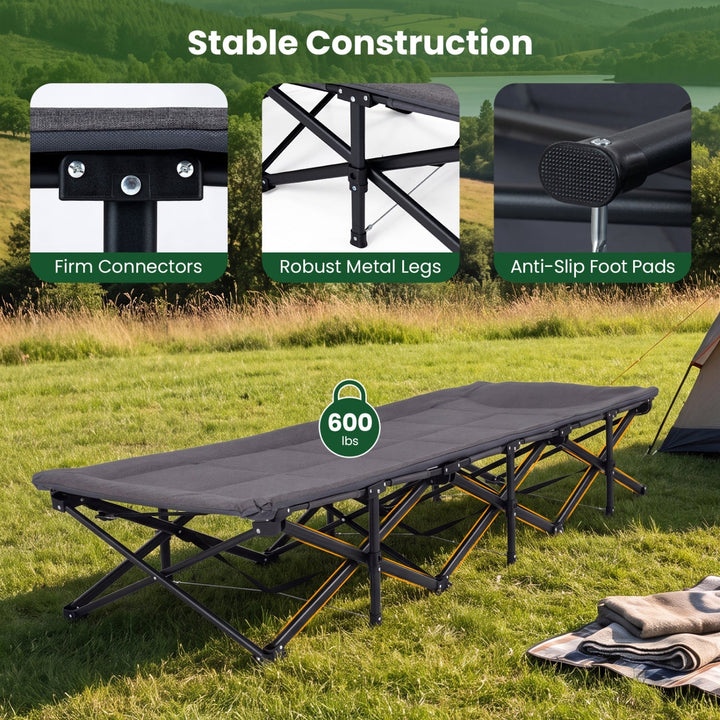 Gray folding camping cot with padded mattress and sturdy black metal legs