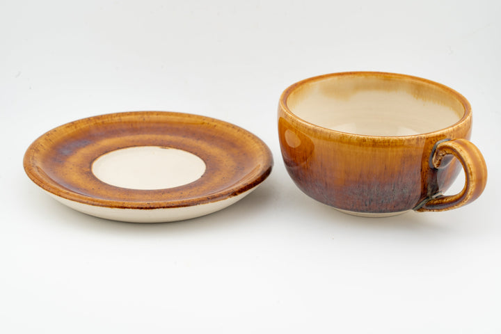 Orange-brown glazed cappuccino cup and saucer set, handle and wide saucer