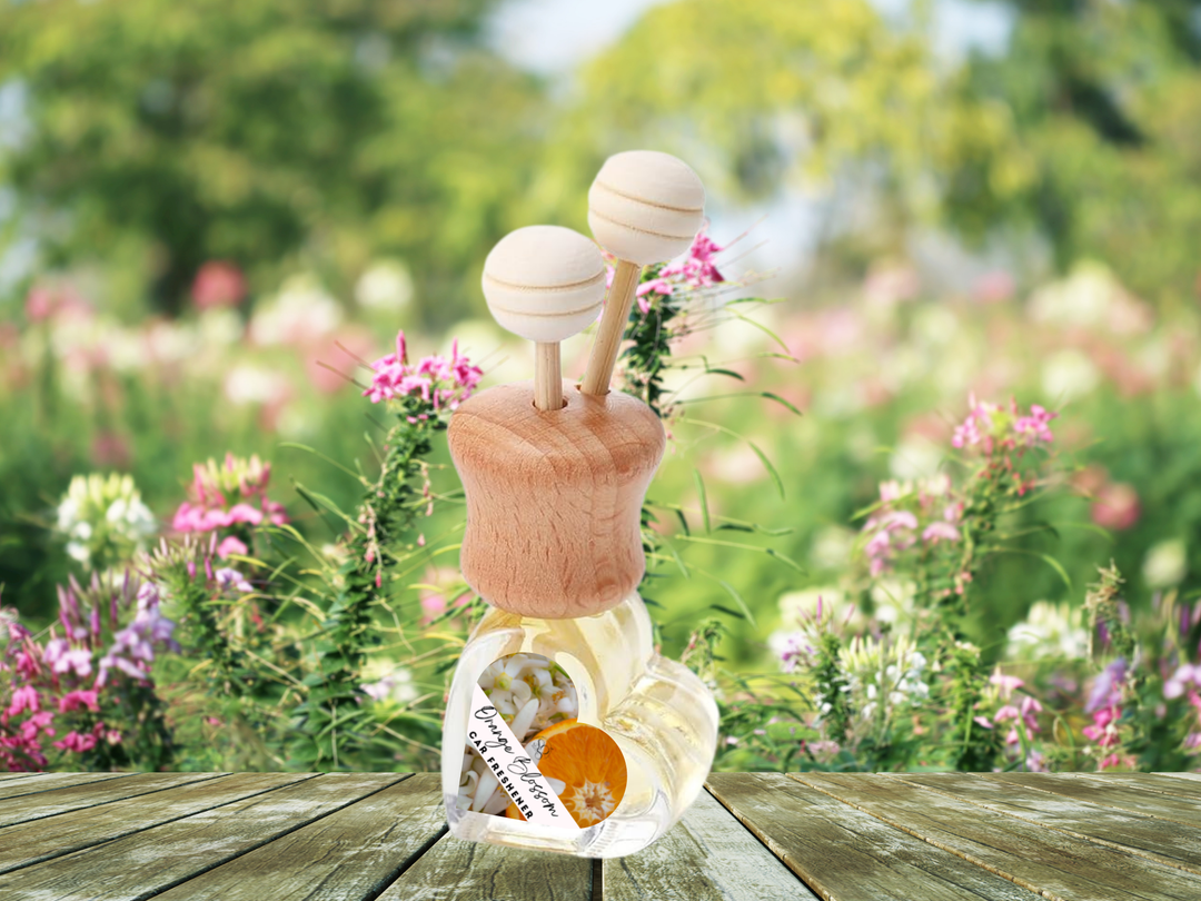 Car vent diffuser glass bottle with wooden base and flower-decorated scent holder