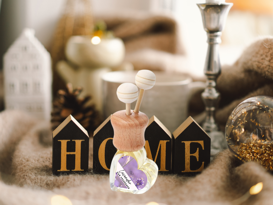 Car vent diffuser with clear bottle, wooden base, two knobs, and floral scent tag