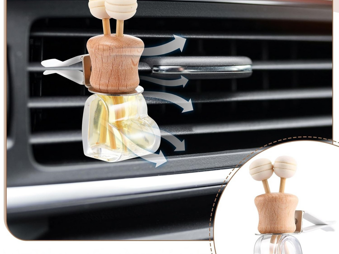 Car vent diffuser with wooden holder and glass bottle on car air vent