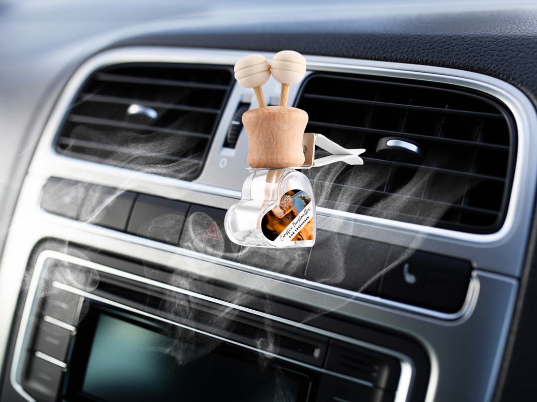Car air vent diffuser with clear bottle, wooden base, two knobs, and hanging scent label