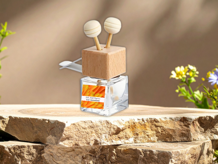 Square car vent diffuser bottle with wooden top and two air freshener sticks