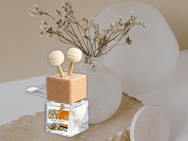 Car vent diffuser glass bottle with wooden base and hanging blossom scent holder