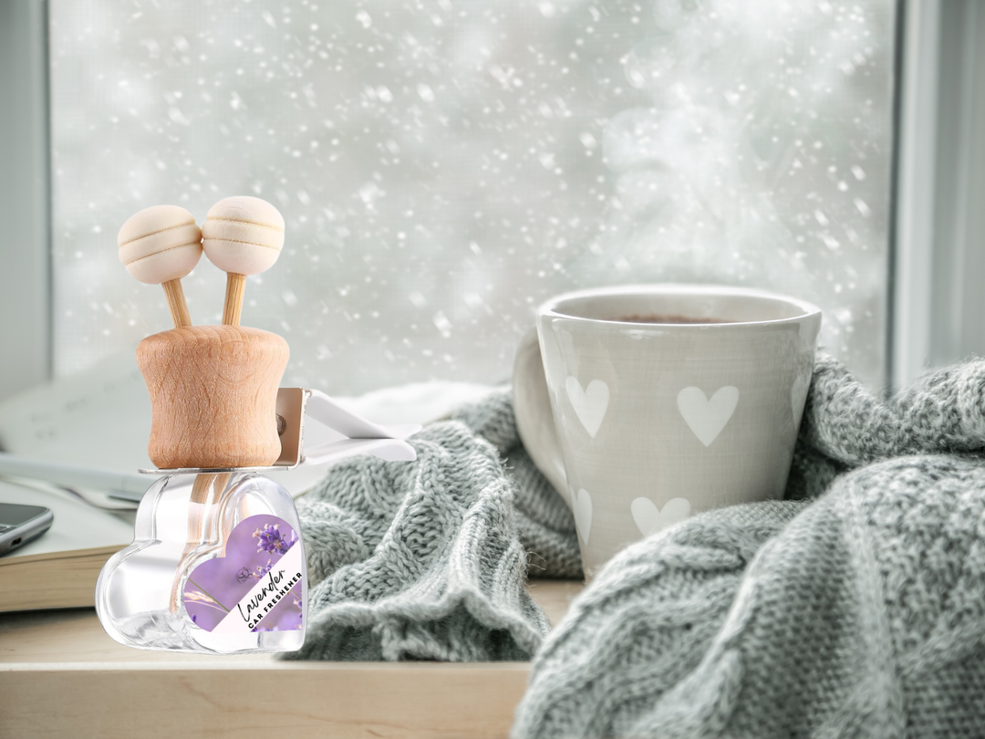 Car vent diffuser glass bottle with wooden holder and heart-pattern mug on tray