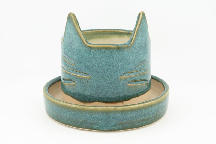 Teal cat-shaped planter with matching saucer, textured glaze finish