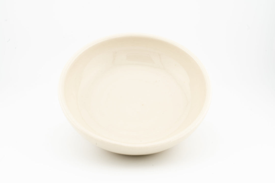 Cream ceramic cat dish with smooth matte glaze