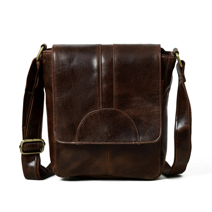Brown leather messenger bag with front flap, centered pocket, and adjustable shoulder strap