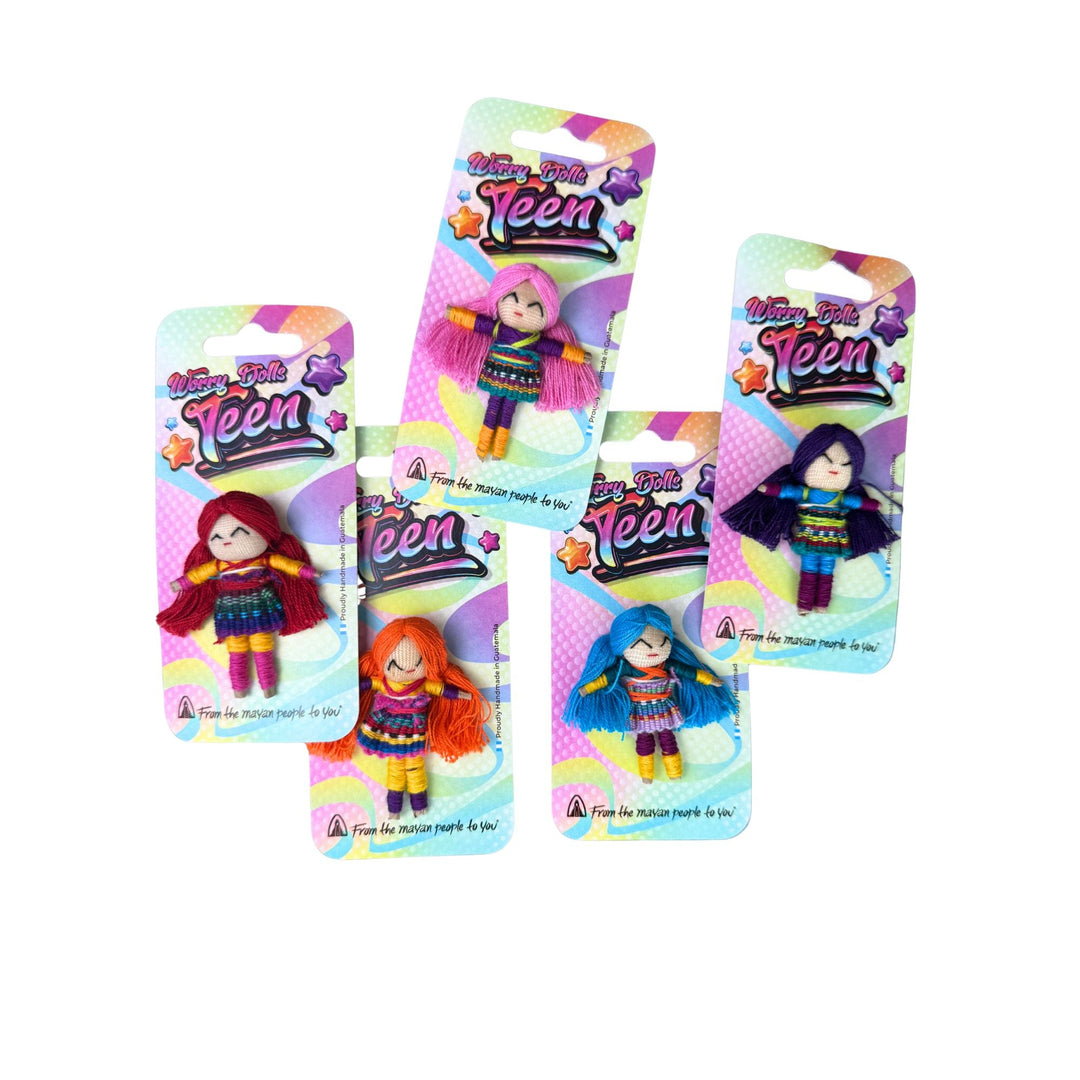 Teen worry doll with red yarn hair, patterned outfit, on blister card