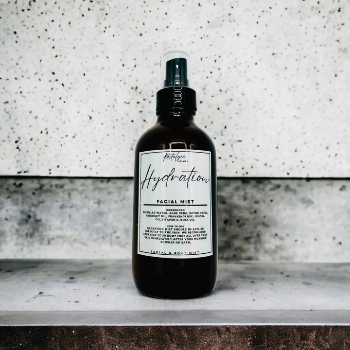 Facial mist in dark glass bottle with black cap